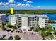 Waterfront condo building with multiple stories, well-kept grounds, and ample parking for residents and guests at 5 Riverwalk Dr # 601, New Smyrna Beach, FL 32169