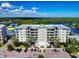 Lovely waterfront condo building offering serene views, beautiful landscaping, and convenient parking spaces at 5 Riverwalk Dr # 601, New Smyrna Beach, FL 32169