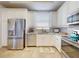 Bright kitchen featuring stainless steel appliances, light countertops and ample cabinet space at 5 Riverwalk Dr # 601, New Smyrna Beach, FL 32169