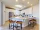 Bright kitchen featuring stainless steel appliances, granite countertops, a kitchen island with seating at 5 Riverwalk Dr # 601, New Smyrna Beach, FL 32169