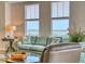 Cozy living room features ample natural light, comfortable seating, and a beautiful waterfront view at 5 Riverwalk Dr # 601, New Smyrna Beach, FL 32169