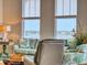 Bright living room with a sofa, view, and decor at 5 Riverwalk Dr # 601, New Smyrna Beach, FL 32169