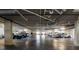 View of the community's well-lit and spacious parking garage with ample spaces at 5 Riverwalk Dr # 601, New Smyrna Beach, FL 32169