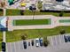 Overhead view of a bocce ball court, shuffleboard, and well-manicured landscaping at 5 Riverwalk Dr # 601, New Smyrna Beach, FL 32169