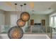Stylish interior with unique pendant lights, an open floor plan, and modern decor at 5023 Sawyer Cove Way, Windermere, FL 34786