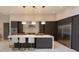 Elegant kitchen featuring a spacious island, modern fixtures, and sleek stainless steel appliances at 5023 Sawyer Cove Way, Windermere, FL 34786