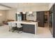Open kitchen with a large island, stainless steel appliances, and modern lighting fixtures at 5023 Sawyer Cove Way, Windermere, FL 34786