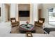 Elegant living room features stylish furniture, a unique wall design, and plenty of natural light at 5023 Sawyer Cove Way, Windermere, FL 34786