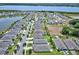 An aerial view of a beautiful neighborhood with lake and well-manicured lawns in a desirable location at 5164 Chickadee St, St Cloud, FL 34771