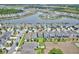 An aerial view showcases the property nestled in a well-maintained neighborhood, complete with lush lawns and scenic surroundings at 5164 Chickadee St, St Cloud, FL 34771