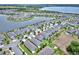 An aerial view showcases the property nestled in a well-maintained neighborhood, complete with lush lawns and scenic surroundings at 5164 Chickadee St, St Cloud, FL 34771