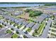 An aerial view showcases the property nestled in a well-maintained neighborhood, complete with lush lawns and scenic surroundings at 5164 Chickadee St, St Cloud, FL 34771