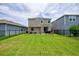 Well-maintained backyard with a patio, grill, and full fencing around the property at 5164 Chickadee St, St Cloud, FL 34771