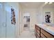 Bathroom featuring a walk-in shower, double sinks, and a walk in closet at 5164 Chickadee St, St Cloud, FL 34771