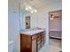 Bathroom vanity features double sinks, a large mirror, and ample storage space at 5164 Chickadee St, St Cloud, FL 34771