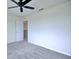 Neutral carpeted bedroom with ceiling fan at 5164 Chickadee St, St Cloud, FL 34771