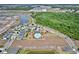 An aerial view of the community featuring a swimming pool, playground, and clubhouse for residents to enjoy at 5164 Chickadee St, St Cloud, FL 34771