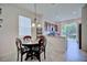Charming dining area with a round table, comfortable seating, and a view into the kitchen at 5164 Chickadee St, St Cloud, FL 34771