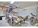 A well-organized garage featuring storage racks, work table, and a motorcycle at 5164 Chickadee St, St Cloud, FL 34771