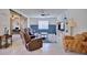 Inviting living room with a comfy sofa, entertainment center, and ample natural light at 5164 Chickadee St, St Cloud, FL 34771