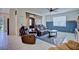 Cozy living room featuring a sliding barn door, comfortable seating, and tiled flooring at 5164 Chickadee St, St Cloud, FL 34771