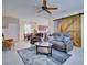 Spacious living room featuring a barn door, comfortable furniture, and an open layout at 5164 Chickadee St, St Cloud, FL 34771