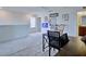 Upstairs loft featuring a desk and comfortable rocking chair with various decorations at 5164 Chickadee St, St Cloud, FL 34771