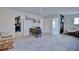 A versatile loft space with neutral carpet, desk area, and open doorways at 5164 Chickadee St, St Cloud, FL 34771