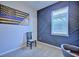 Bright office space with a unique accent wall, modern furniture and neutral carpet at 5164 Chickadee St, St Cloud, FL 34771