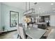 Open dining area adjacent to the kitchen featuring modern decor and abundant natural light at 5427 Orange Orchard Dr, Winter Garden, FL 34787