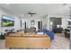 Open-concept living room featuring hardwood-style floors, modern decor, and staircase access at 5427 Orange Orchard Dr, Winter Garden, FL 34787