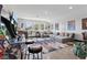 Large living room with game room, hardwood floors, modern couch, and stylish decor at 5427 Orange Orchard Dr, Winter Garden, FL 34787