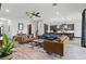 Open-concept living area with a seamless flow to the kitchen, stylish seating, and neutral decor at 5427 Orange Orchard Dr, Winter Garden, FL 34787