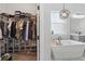 Large walk-in closet with extensive shelving, shoe storage, and ample room for hanging clothes at 5427 Orange Orchard Dr, Winter Garden, FL 34787