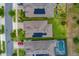 Aerial view of homes with solar panels and a backyard pool at 553 Adenmore Ter, Deland, FL 32724