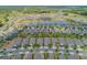 Community aerial view with meticulously maintained homes, lush landscaping, and multiple scenic ponds at 553 Adenmore Ter, Deland, FL 32724