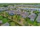 Aerial view of the property with lush greenery, mature trees, and a well-maintained backyard area at 553 Adenmore Ter, Deland, FL 32724