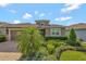 Inviting home exterior with a lush, landscaped front yard and a paver driveway at 553 Adenmore Ter, Deland, FL 32724