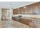 A spacious kitchen showcases granite countertops, stainless steel appliances and dark cabinetry at 553 Adenmore Ter, Deland, FL 32724
