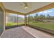 Relaxing screened patio with brick pavers and ceiling fan, offering a great outdoor space at 553 Adenmore Ter, Deland, FL 32724