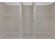 Spacious walk-in closet with wire shelving for optimal storage at 553 Adenmore Ter, Deland, FL 32724