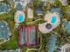 Aerial view of community amenities including tennis courts and swimming pools at 6100 Westgate Dr # 101, Orlando, FL 32835