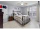 Comfortable bedroom featuring a ceiling fan, a queen-size bed, and bright windows for natural light at 6100 Westgate Dr # 101, Orlando, FL 32835