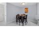 Cozy dining area featuring tile floors, and modern lighting creating a warm atmosphere at 6100 Westgate Dr # 101, Orlando, FL 32835