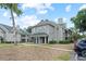 Inviting condominium building showcasing its well-maintained facade and manicured landscaping at 6100 Westgate Dr # 101, Orlando, FL 32835