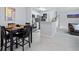 Modern kitchen with stainless steel appliances, granite countertops, and a cozy dining area at 6100 Westgate Dr # 101, Orlando, FL 32835