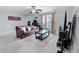 Comfortable living room featuring tile floors, and ample natural light at 6100 Westgate Dr # 101, Orlando, FL 32835