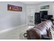 Cozy living room featuring a comfortable couch and office setup, bathed in natural light at 6100 Westgate Dr # 101, Orlando, FL 32835