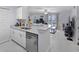 Open concept living and kitchen area featuring tile floors and a view into the living room at 6100 Westgate Dr # 101, Orlando, FL 32835