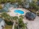 Community pool and gazebo in lush landscaped condominium complex at 6100 Westgate Dr # 101, Orlando, FL 32835
